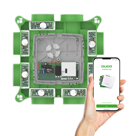 DucoBox Focus ventilation unit with an installed Duco Installation Kit and smartphone with the Duco Installation App